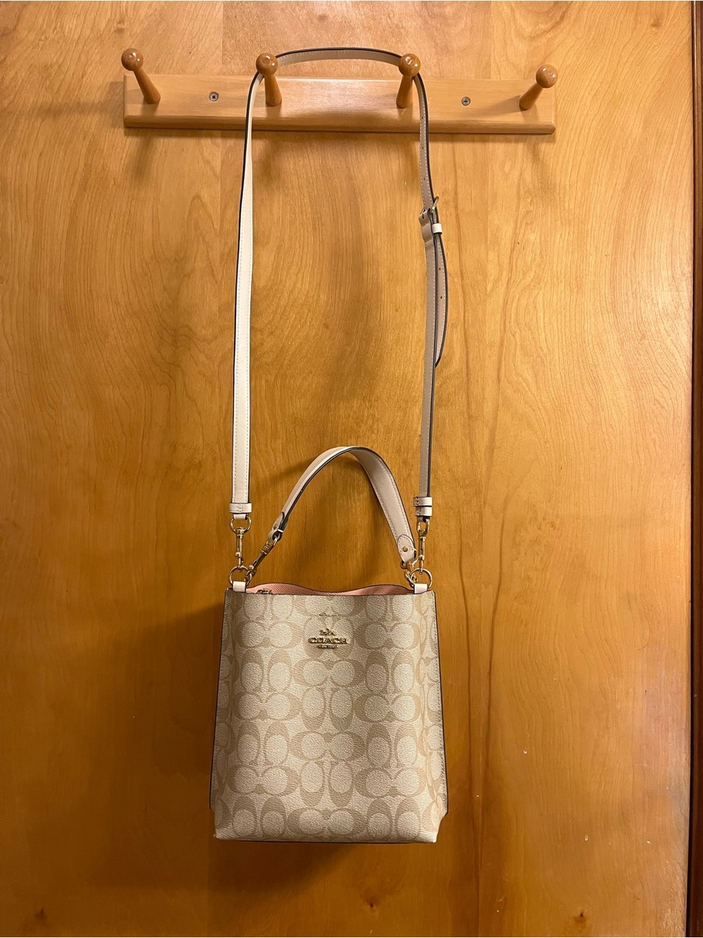 Coach Signature Canvas Small Bucket Crossbody in Chalk and Cute Pink interior.